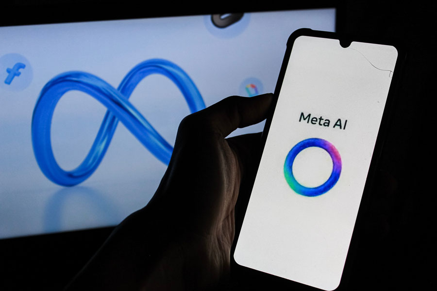 In this photo illustration, Meta AI logo is displayed on a smartphone with Cyber Meta Logo in the background.